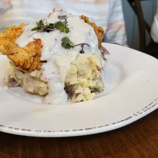 fried chicken on garlic mashed potatoes