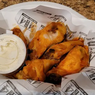 Buffalo wings. The picture doesn&apos;t show it very well, but they were all very pale like the top one. Flabby skin, not crispy at all.