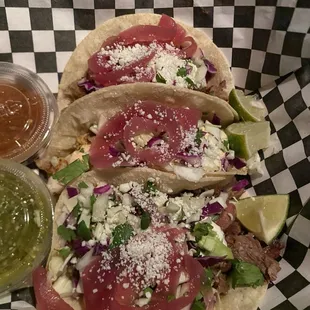 Pork, chicken, and beef tacos