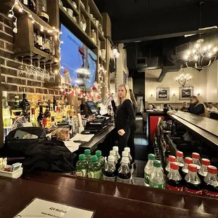 a woman behind the bar