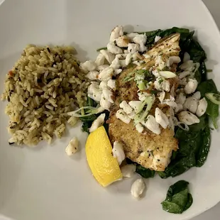 Entree of halibut with crab, spinach, and rice