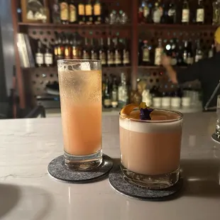 Tall glass: queen emma Short glass: art of kill (i think)