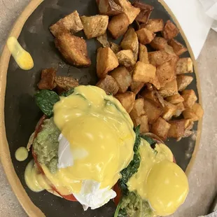 Popeye Benedict with avocado, tomato, and spinach