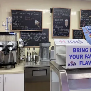 a coffee shop with menus on the wall