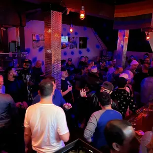 a crowd of people at a bar