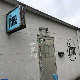 the front of a building with a sign on it