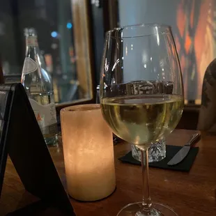 a glass of wine on a table