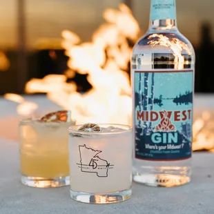 Midwest Gin Cocktails in front of the 45th Parallel Distillery patio fire pit - Featuring Bees Knees and Gimlet.