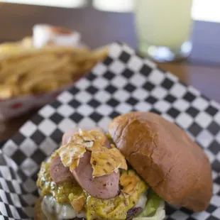 The German. A burger plus a hot dog with all the fixings. And then some.