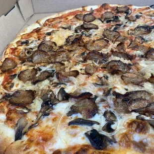 Large pizza with sausage, garlic, mushrooms, &amp; onions