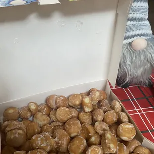 a gnome and a box of donuts