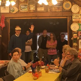 Bill Meissner, owner of the 49er RV Ranch waving from amidst the crowd at the annual Thanksgiving dinner the Ranch throws for all guests.