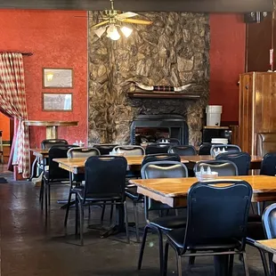 tables, chairs, and a fireplace