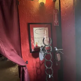 a red wall with a picture of a man on it