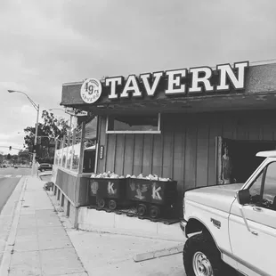 a truck parked in front of a restaurant