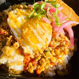 Pork Sisig with Crispy Pork Belly ,fried egg , pickled onions