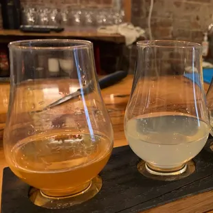 three glasses of beer on a bar