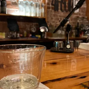 a glass of water on a bar