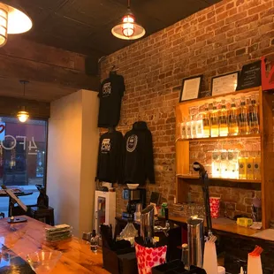 a bar with a brick wall