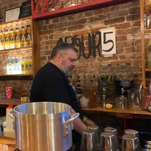 a man preparing a drink