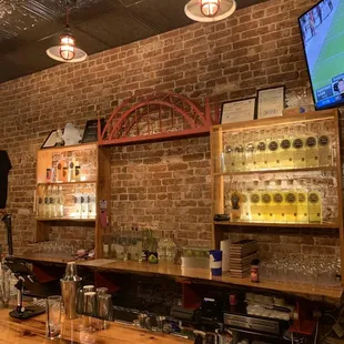 a bar with a brick wall