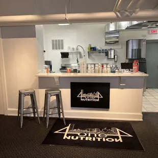 a kitchen with a bar and stools