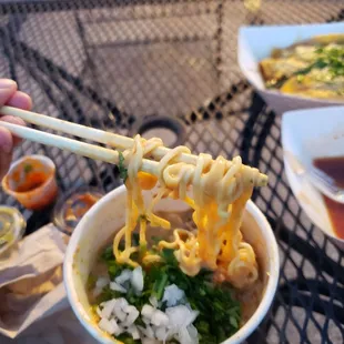 Cheesy birria ramen w/ cilantro and onion...new menu item coming in August.