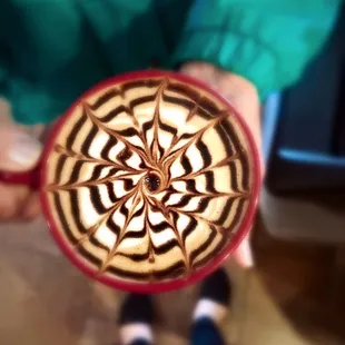 a person holding a cup of coffee