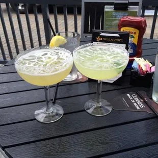 Cadillac margarita on the left and a regular margarita on the rocks with salt.