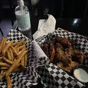 Korean BBQ and Cajun Wings with Seasoned Fries.