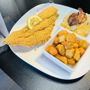 Brunch...fish, potatoes and side of shrimp and grits.