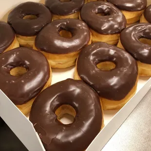 a box of chocolate frosted donuts