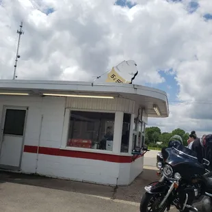 a motorcycle parked in front of a diner