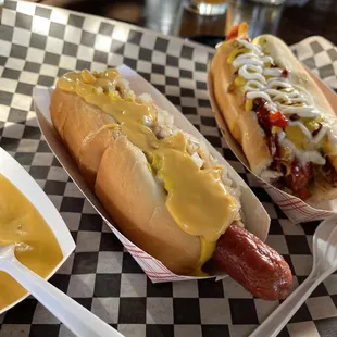two hot dogs with mustard and relish