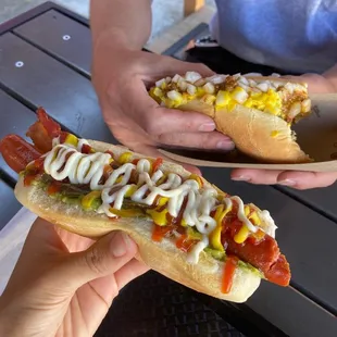Coney Dog in the back. The one in the front had bacon, guacamole, garlic mayo, and lots of other delicious condiments. Both very good!