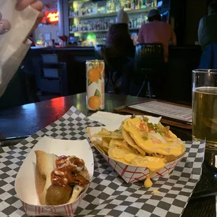 a hot dog and chips on a table