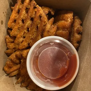 a box of french fries and ketchup