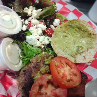 Turkey burger with avocado, lettuce, tomato &amp; side salad.