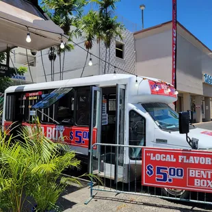  a food truck parked in front of a restaurant