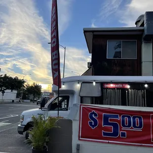  a truck parked in front of a restaurant
