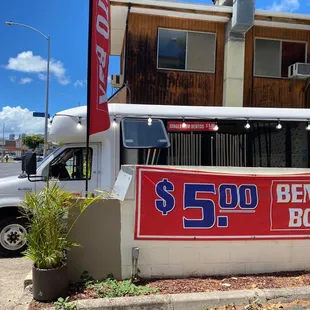  a delivery truck parked in front of a building