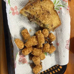 Jessie's Special burger cut in half and tots