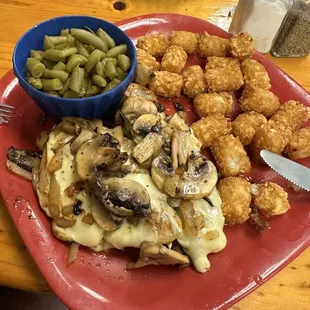 Southwest chicken with two cheeses and mushrooms, green beans and tater tots.