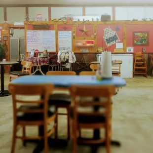 a classroom with tables and chairs