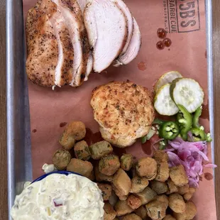 1 meat + 2 sides plate with chicken, potato Salad, fried okra, and a cheddar biscuit