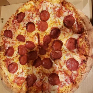 a pepperoni pizza in a box