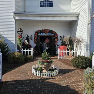 the front of a house decorated for christmas