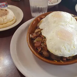 House skillet on home fries, eggs over medium