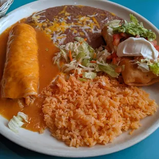 Enchilada and Chimichanga Large Combinations with Chicken, Fried Rice, Bean and Coleslaw.