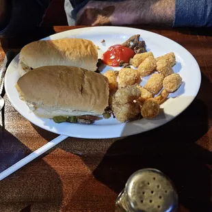 Philly Steak sandwich with crispy tots.